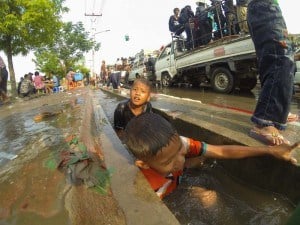 Kids Playing In The Drain.