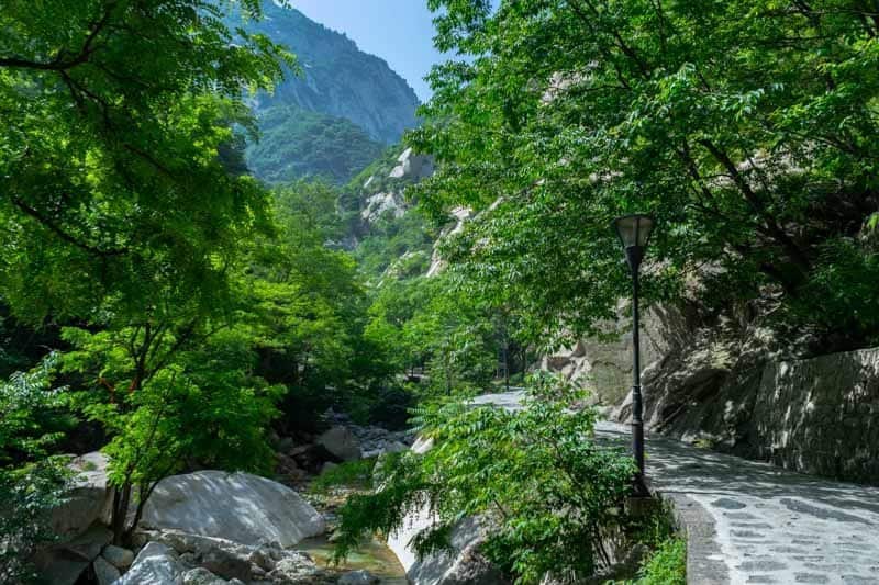 Staring over the border on the Mount Huashan hike Surviving The World’s Most Dangerous Hike – Mt Huashan