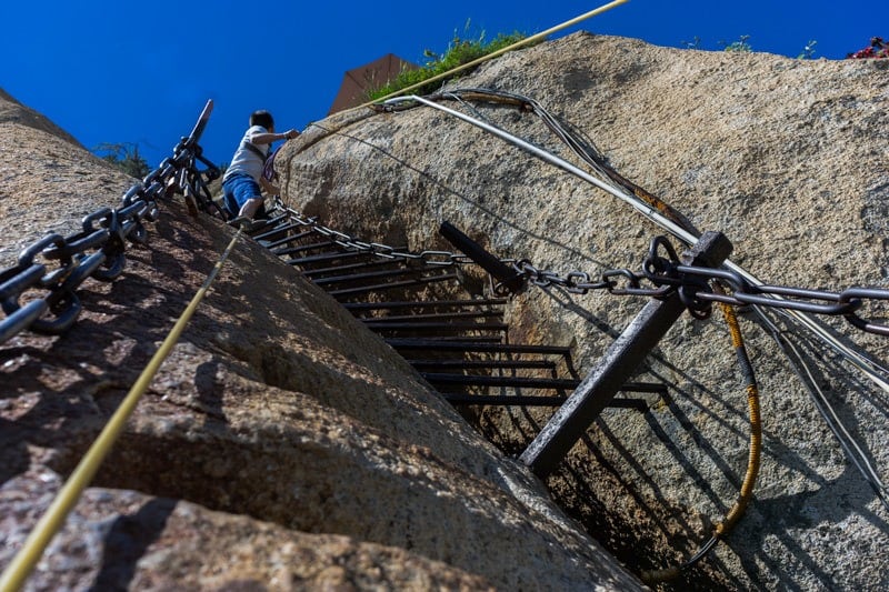 Staring over the border on the Mount Huashan hike Surviving The World’s Most Dangerous Hike – Mt Huashan