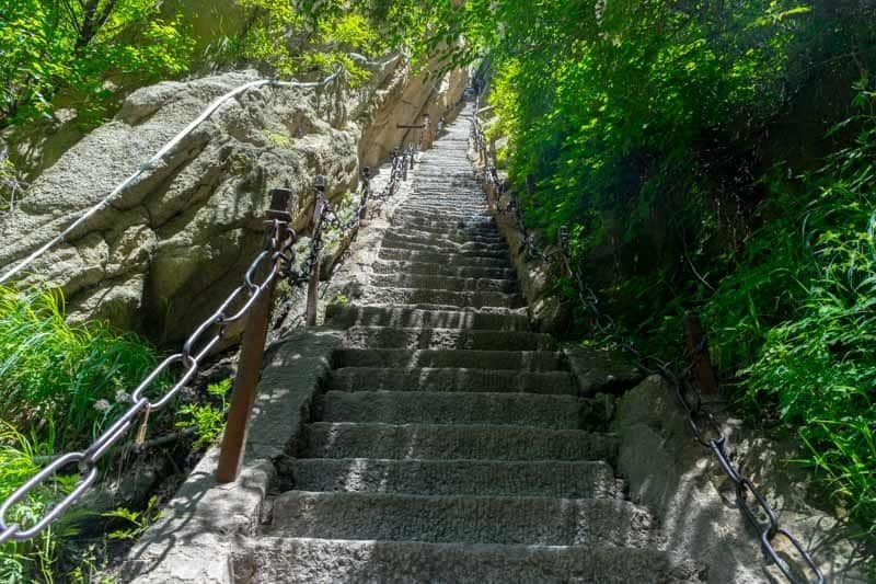 Staring over the border on the Mount Huashan hike Surviving The World’s Most Dangerous Hike – Mt Huashan