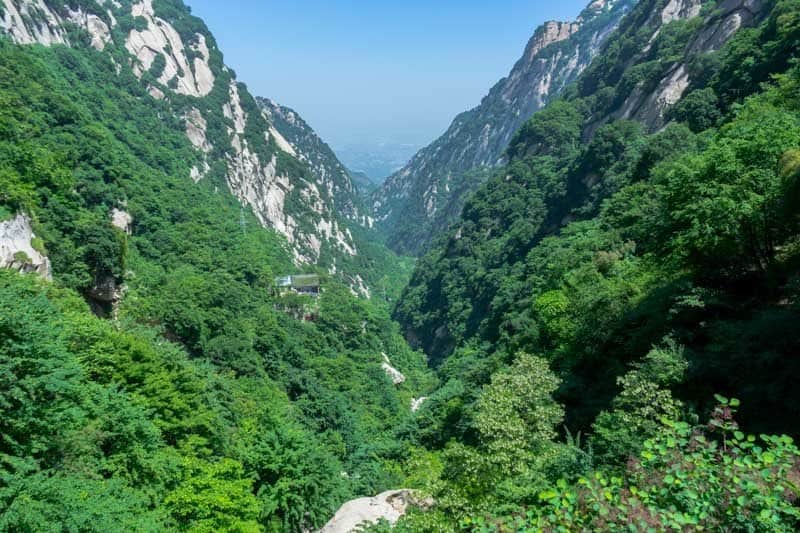Staring over the border on the Mount Huashan hike Surviving The World’s Most Dangerous Hike – Mt Huashan