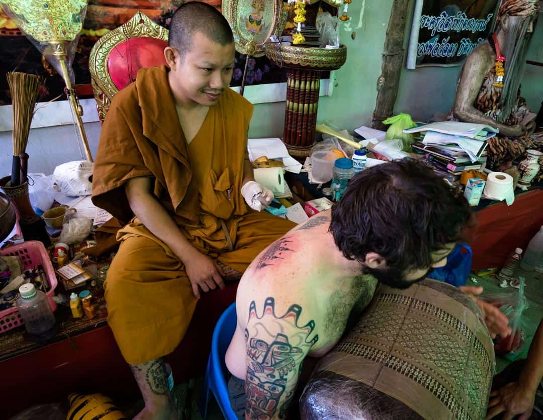 Tattooed monk at Mahabodhi Temple, Bodhgaya, Bihar, India Stock Photo -  Alamy