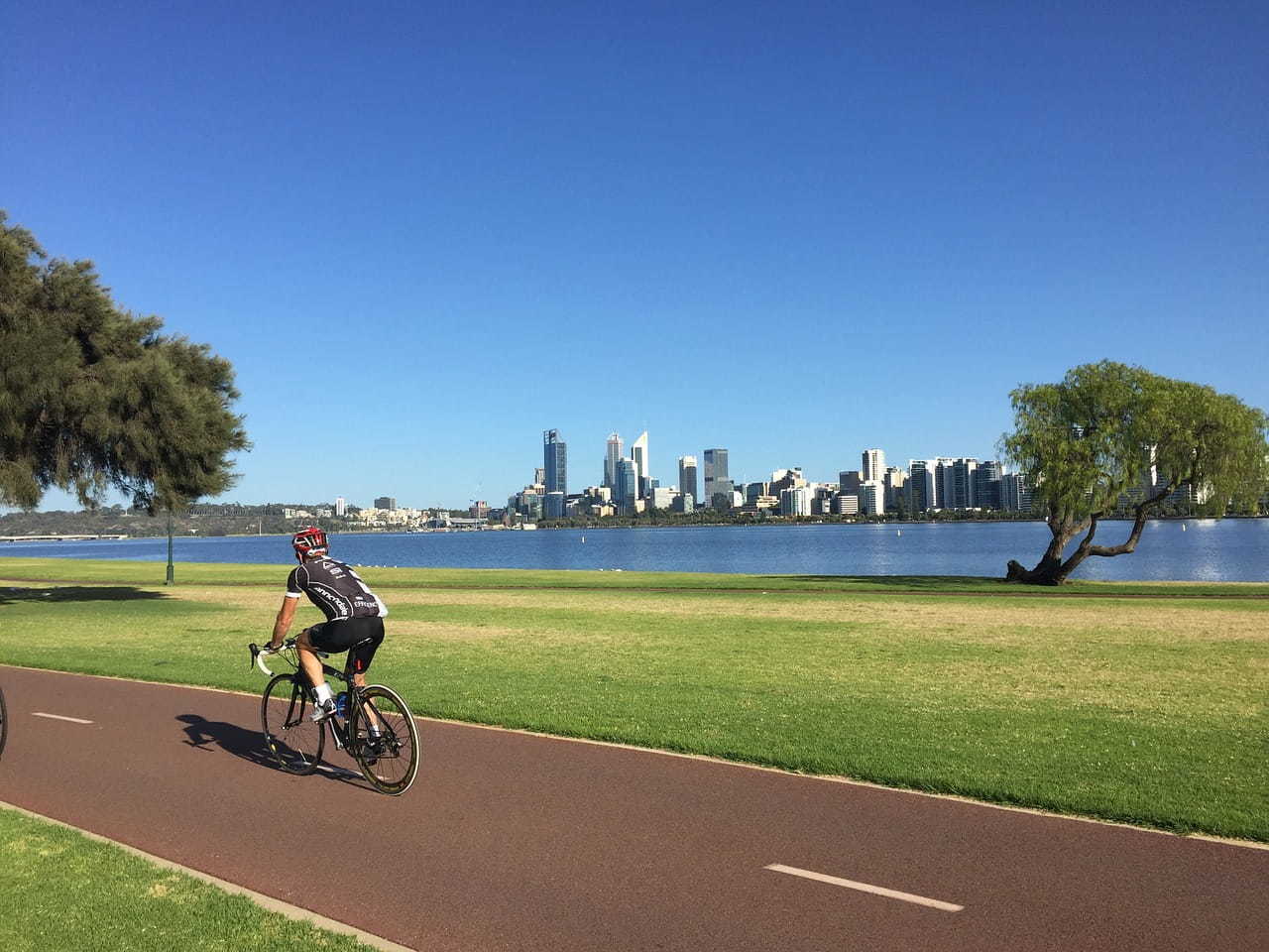 Cyclist Biking Along Foreshore