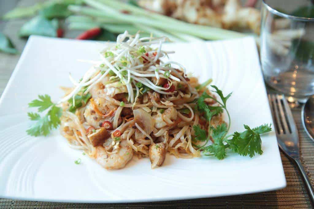 Pad Thai, A Classic Thai Dish Of Stir-Fried Noodles, Peanuts, Bean Sprouts, Scrambled Eggs, And Either Meat, Seafood Or Tofu.