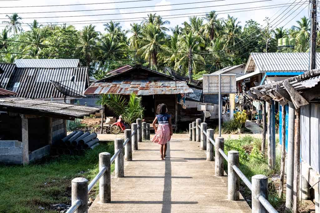 Girl Walking Down Pier