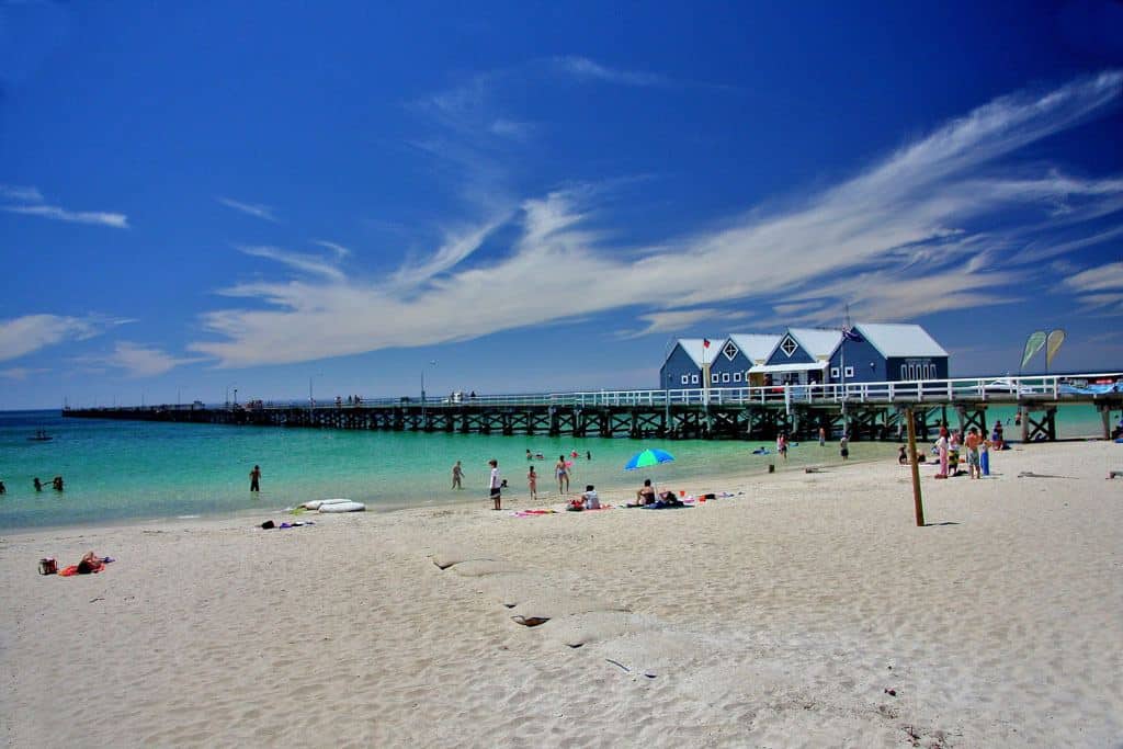 Beach With The Ocean And Long Jetty Leading Out On The Water 