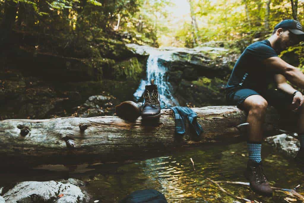 Shoes And Socks In Front Of Waterfall
