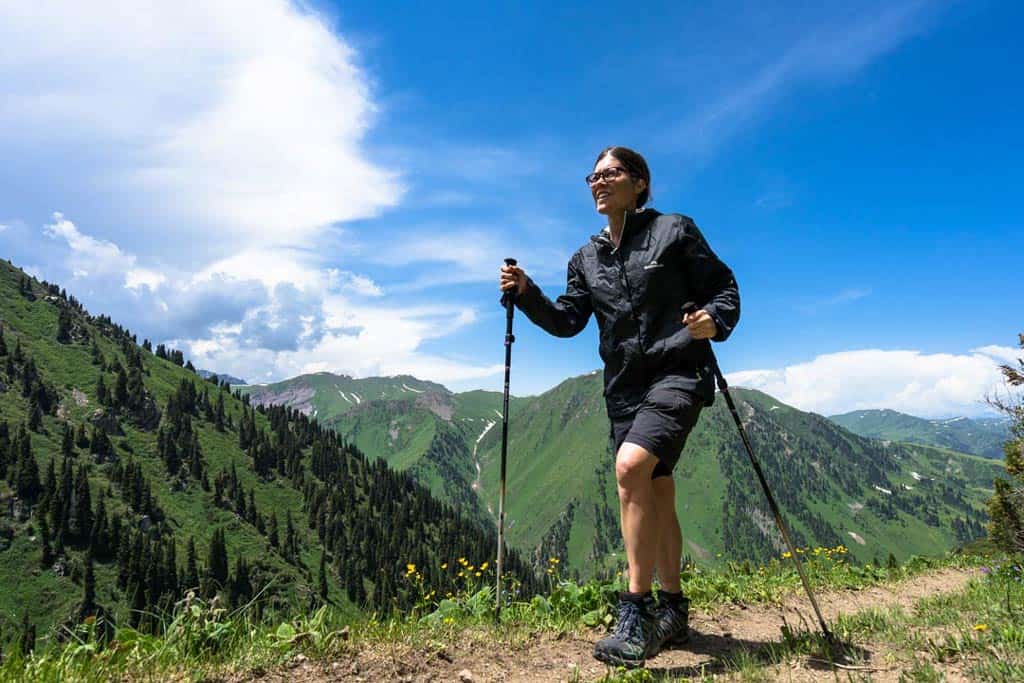 Lady Hiking With Trekking Poles
