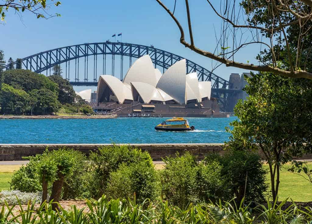 Boat With Opera House And Bridge In Background