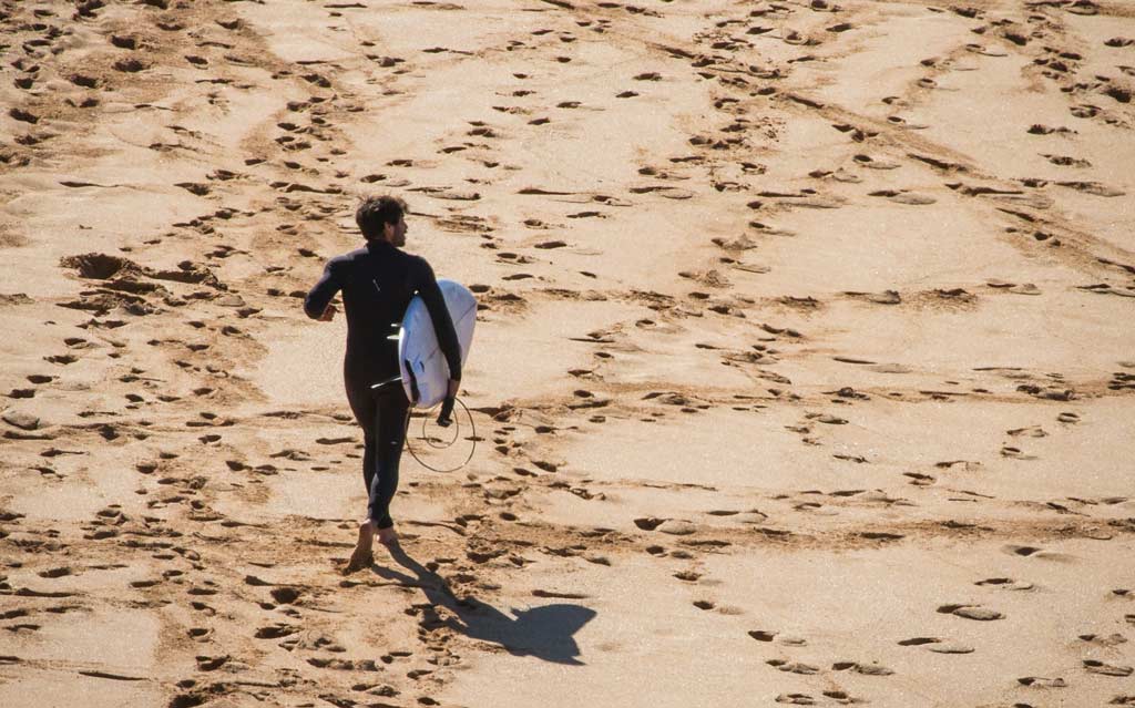 Surfer Running On Best Sydney Beaches