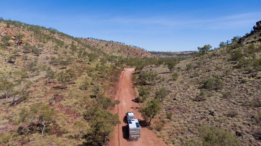 Ute And Caravan Driving Into Cobbold Gorge
