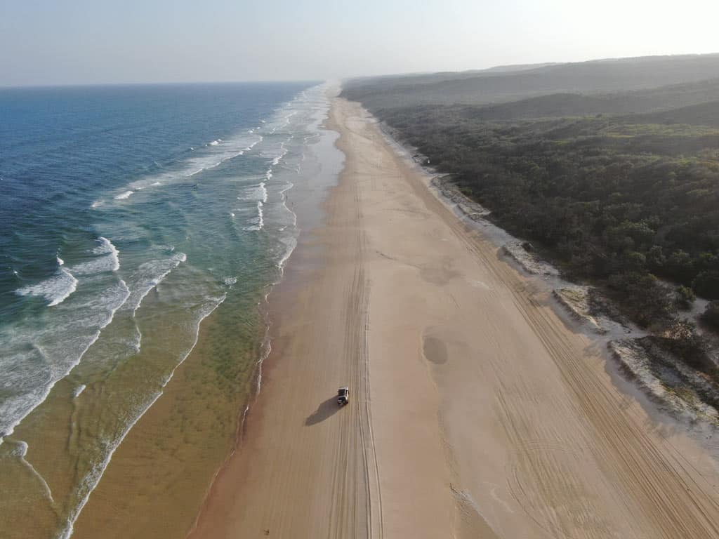 Car Driving On Beach