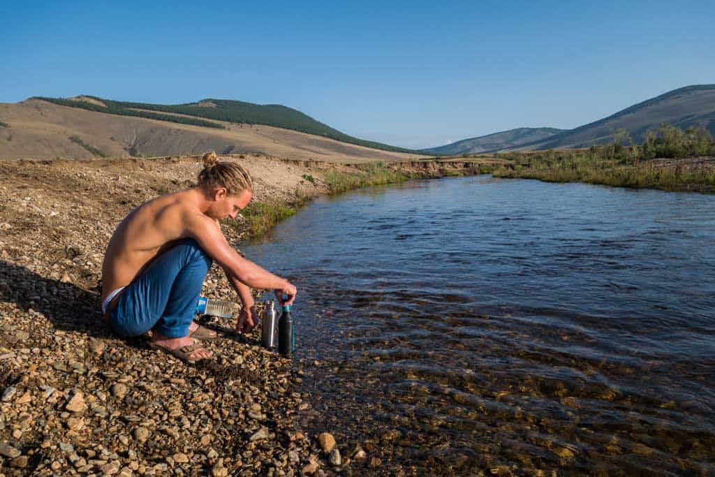 Filling Up Water Bottle From A River