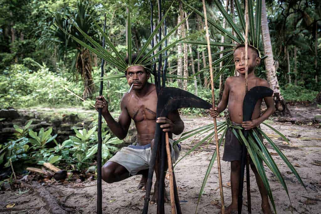 A Father And Son Hold Their Spears Before The Fight Begins.