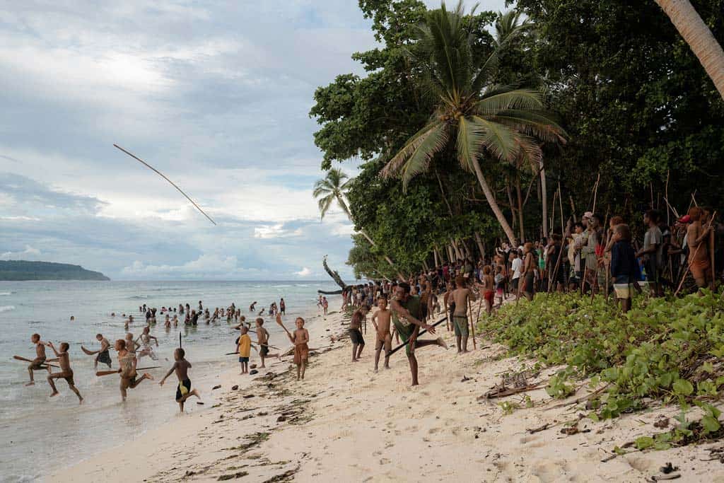 The Men Throw Their Spears Into The Sea, Hurling The Evil Spirits Off The Land.