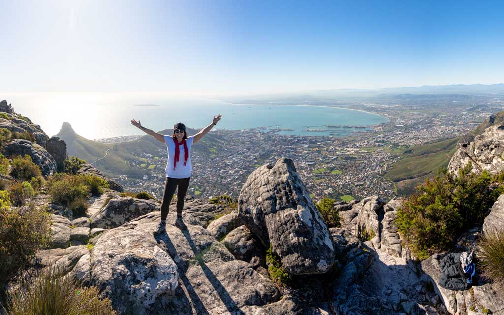 Person With Hands Up With Cape Town In Background