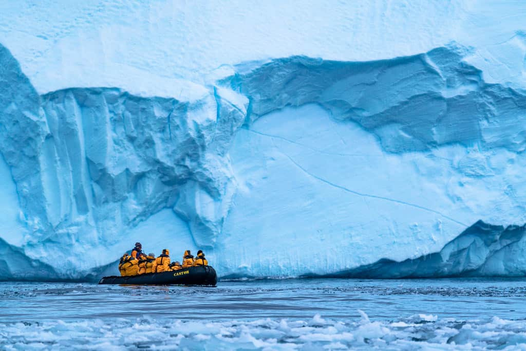 Zodiac In Front Of Iceberg Antarctica Expeditions