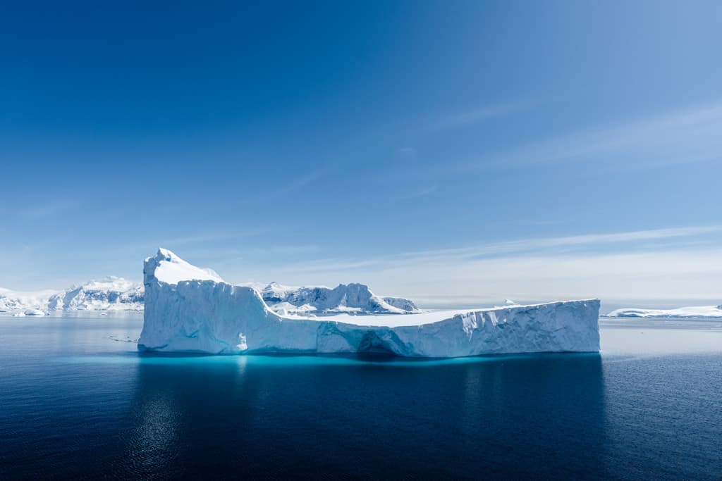 Blue Iceberg In Antarctica