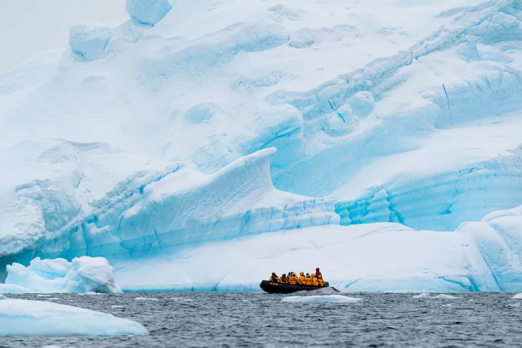 Zodiac In Front Of Iceberg Antarctica Expedition
